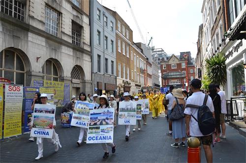 '图1～8：二零一八年七月二十一日，英国法轮功学员举办反迫害十九周年游行。'