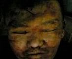 曾在泰来监狱冰柜里的伤痕累累的刘晶明遗体。