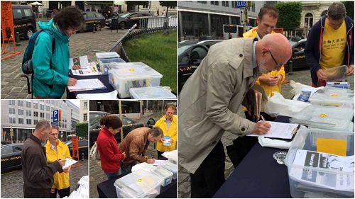 布鲁塞尔欧洲议会大楼前，人们纷纷签名支持法轮功反迫害