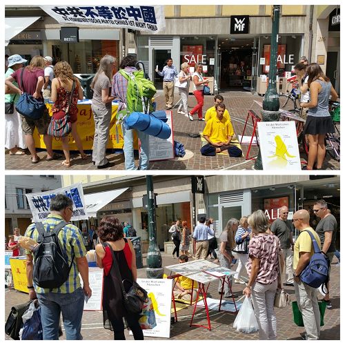 图1-2：二零一六年七月二十二日，法轮功学员在德国大学城弗莱堡市传播法轮功的真相，一群一群的民众驻足阅读真相展板。