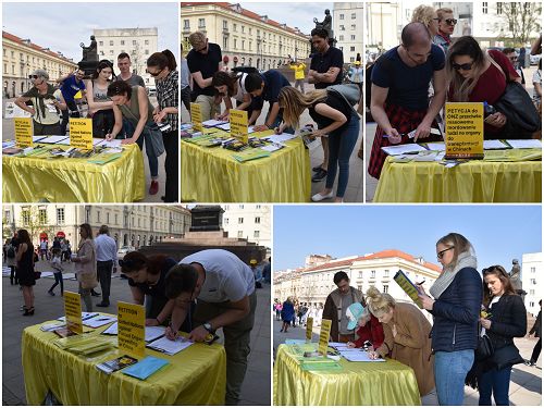 图1：波兰市民和游客纷纷参加反对中共迫害法轮功的征签活动