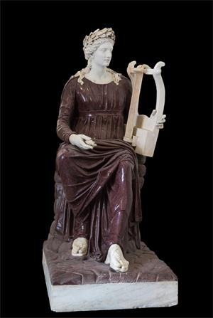图例：阿波罗持琴座像（Apollo seated with lyre），由斑岩和大理石制成，作于公元二世纪，现存于那不勒斯国立考古博物馆。（网络图片）